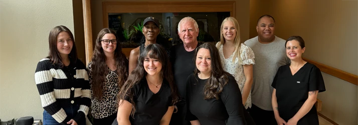 Dr. Thomas Talburt and the team posing inside the clinic